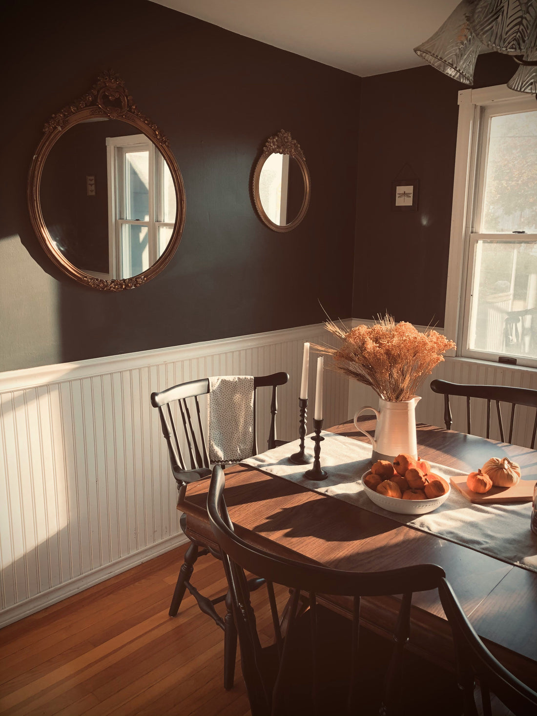 How a Dark Wood Dining Table Set Creates a Warmer Dining Room