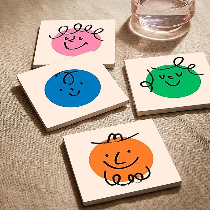 MAYCARI Cartoon Colorful Face Coasters Set of 6 Cork Backed Cute Coasters with Metal Holder Original Ceramic Surface Drink Cup Mats for Tabletop Protection Modern Desk Decoration Birthday Gifts